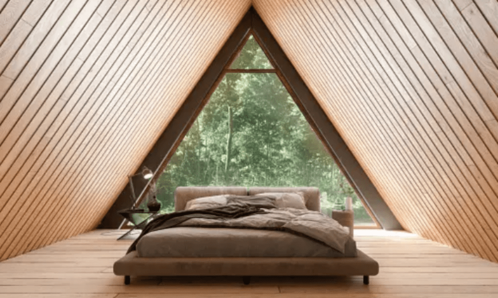 Bedroom with bed and window, natural light illuminating the room